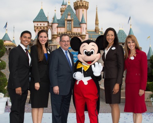 Disneyland President George Kalogridis with current and former ambassadors, plus Mickey Mouse