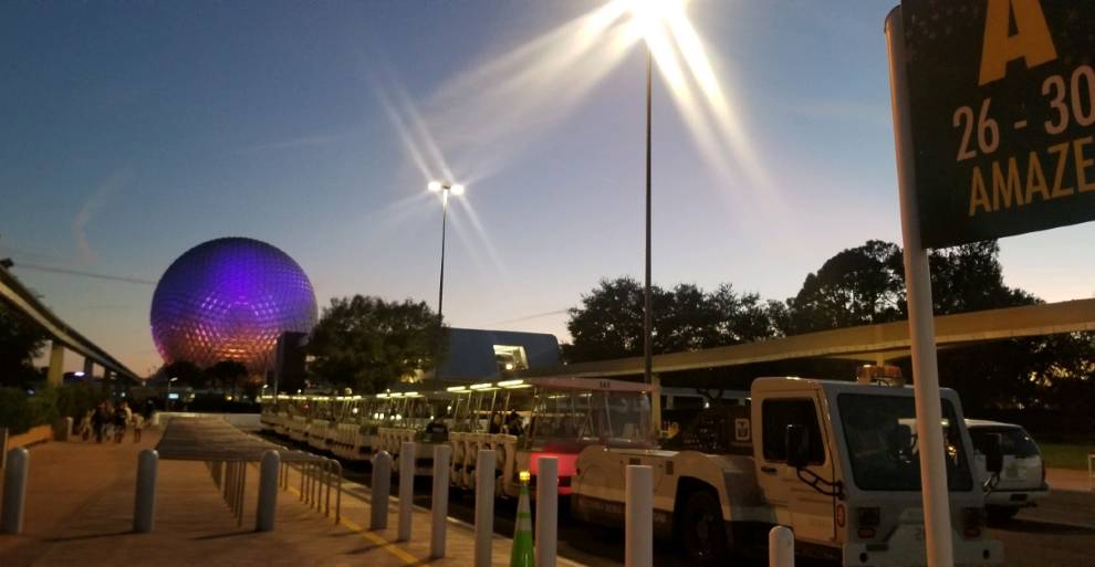 EPCOT tram loading zone with Spaceship Earth in the background.
