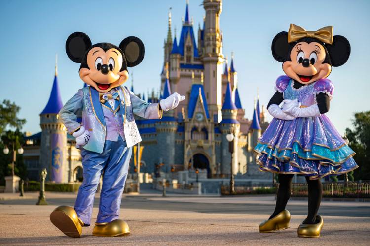 Mickey and Minnie at Walt Disney World  in their EARidescent 50th anniversary outfits