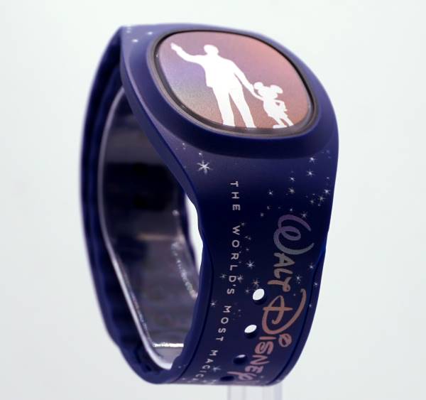 New MagicBand+ for Walt Disney world 50th anniversary is dark blue with stars and the silhouette of the partner's statue on its face. 